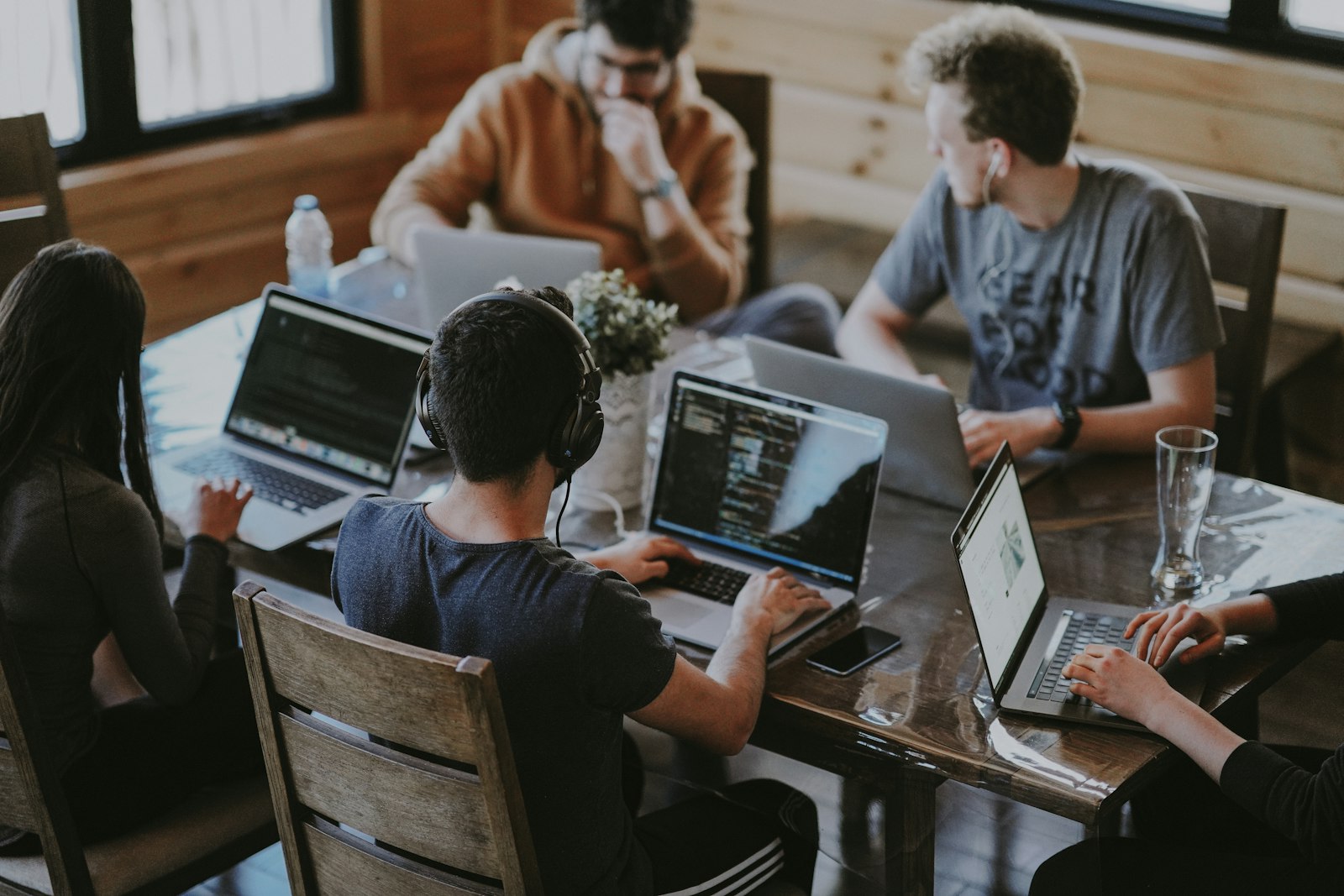 Consultants collaborating with a business owner
